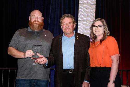 Swede McCurdy, Brad Howard (from Security Contracting Services SCS) & Kendra Holeman accepting our 2019 American Fence Association Awards.