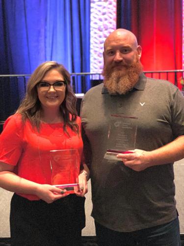 Project Manager Kendra Holeman & Vice President Swede McCurdy accepting our 2019 access controls award & our 2019 Ornamental Iron Project award.

